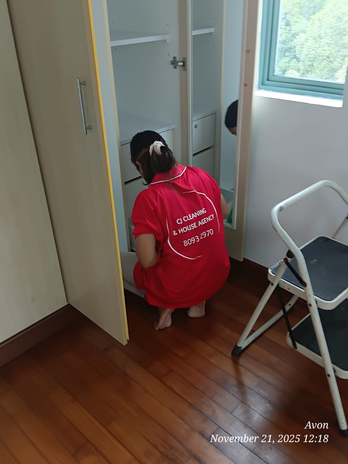 Avalon cleaner organizing wardrobe and tidying bedroom in Singapore home